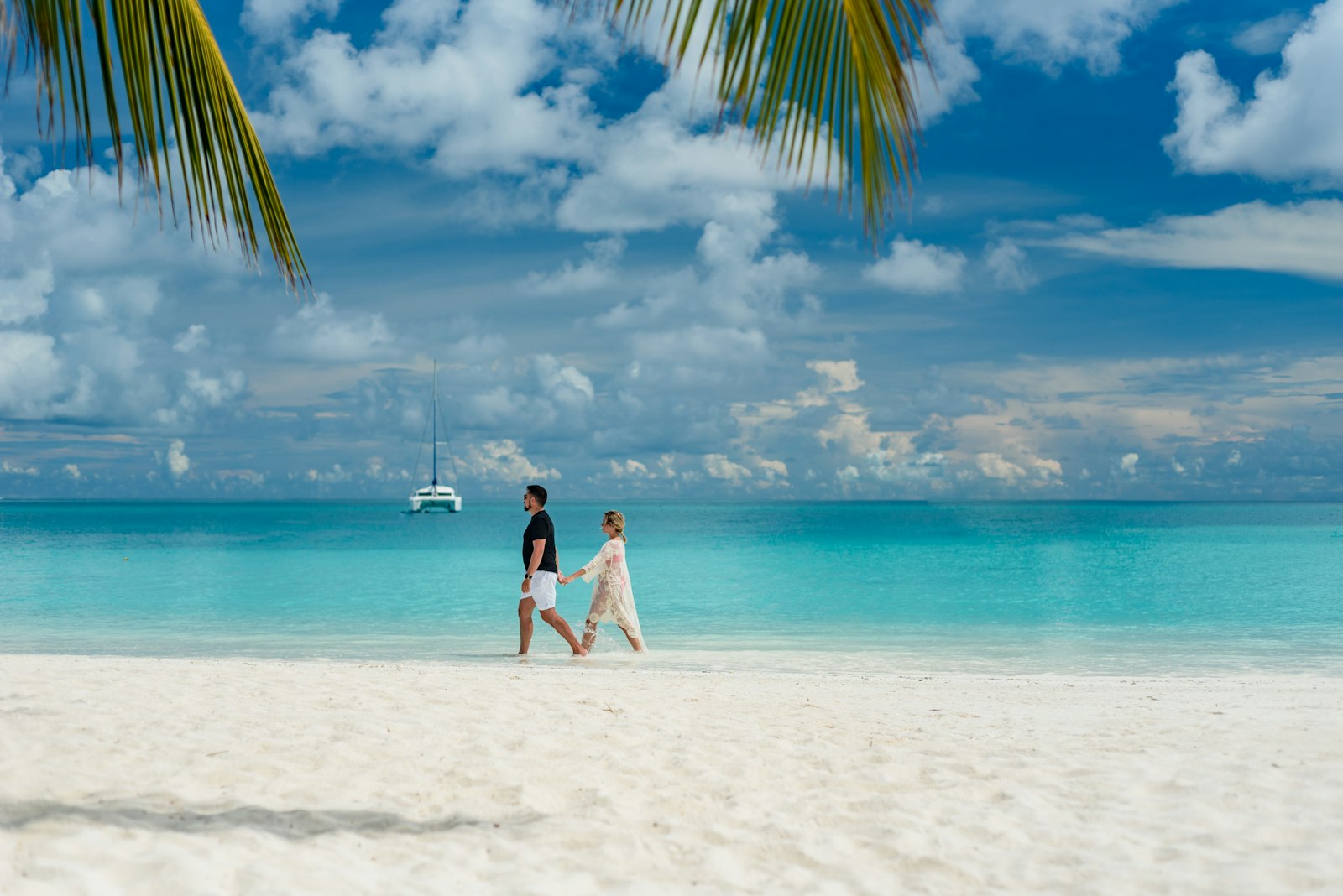 Couple walking on a Maldivian beach